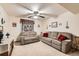 Cozy living room featuring comfortable seating and a ceiling fan for added comfort at 125 S Fulton Ave, Fort Lupton, CO 80621