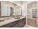 Bathroom features a double vanity, large mirror, and walk-in closet access at 24943 E Phillips Pl, Aurora, CO 80016