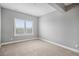 A standard carpeted bedroom features natural light from the window and neutral walls at 24943 E Phillips Pl, Aurora, CO 80016