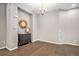 Neutral dining room features dark wood floors and a classic chandelier at 24943 E Phillips Pl, Aurora, CO 80016