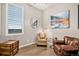 Inviting living room featuring a cozy sitting area and trunk for storage at 24943 E Phillips Pl, Aurora, CO 80016
