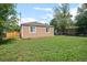 Home featuring a large backyard and partial fencing at 1865 S Knox Ct, Denver, CO 80219