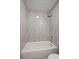 Bathroom featuring a shower/tub combo with tile surround and shower head at 1865 S Knox Ct, Denver, CO 80219
