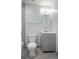 Bathroom featuring a vanity with storage, a toilet, and modern fixtures at 1865 S Knox Ct, Denver, CO 80219