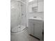 Bathroom featuring a shower with glass door, a vanity, and a modern design at 1865 S Knox Ct, Denver, CO 80219