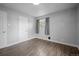 Comfortable bedroom with fresh paint, hardwood floors, and natural lighting from a well placed window at 1865 S Knox Ct, Denver, CO 80219