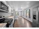 Updated kitchen with stainless steel refrigerator and easy access to a spacious, naturally lit living area at 1865 S Knox Ct, Denver, CO 80219