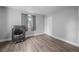 Laundry room with wood floors and a new front load washing machine at 1865 S Knox Ct, Denver, CO 80219