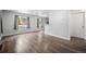 Bright and airy living room with hardwood floors, neutral walls, and stylish curtains, perfect for modern living at 1865 S Knox Ct, Denver, CO 80219