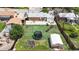 Aerial view of the backyard, featuring a trampoline, shed, patio and brick house at 11261 Clarkson St, Northglenn, CO 80233