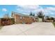 Spacious backyard features a brick house and basketball net, perfect for outdoor enjoyment and recreation at 11261 Clarkson St, Northglenn, CO 80233