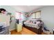 Cozy bedroom featuring hardwood floors and neutral walls at 11261 Clarkson St, Northglenn, CO 80233