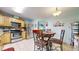 Eat-in kitchen with stainless steel appliances, tile backsplash and light wood cabinets at 11261 Clarkson St, Northglenn, CO 80233