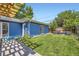 Backyard featuring green grass, wood fence, and outdoor furniture at 2684 S Adams St, Denver, CO 80210