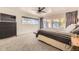 Calm bedroom featuring carpeted floors, a ceiling fan, and sliding glass doors to the outside at 2684 S Adams St, Denver, CO 80210