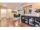 Elegant dining room featuring hardwood floors, stylish decor, and ample natural light, ideal for entertaining at 2684 S Adams St, Denver, CO 80210