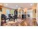 Spacious dining room with hardwood floors, recessed lighting, and a modern glass table with comfortable seating at 2684 S Adams St, Denver, CO 80210
