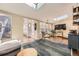 Bright living room featuring a skylight, large windows, hardwood floors and comfortable seating at 2684 S Adams St, Denver, CO 80210