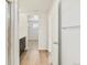 Bright bathroom showing walk-in shower, modern vanity and wood-look floors at 6504 N Malaya St, Aurora, CO 80019