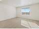 Bedroom with neutral carpet and a large window at 6504 N Malaya St, Aurora, CO 80019