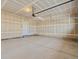 Spacious two car garage with concrete floor and in-progress drywall at 6504 N Malaya St, Aurora, CO 80019