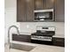 Close up of the kitchen with granite countertops and stainless steel appliances at 6504 N Malaya St, Aurora, CO 80019