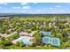 Aerial view of a community featuring swimming pool, tennis courts, green space, and tree-lined streets at 7717 S Grape Ct, Centennial, CO 80122