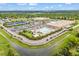 Aerial view of community featuring large swimming pool, tennis courts, shopping center, and ample parking at 7717 S Grape Ct, Centennial, CO 80122