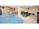 Entertaining basement with theater seating, wet bar, and a ping pong table for recreation and fun at 7717 S Grape Ct, Centennial, CO 80122
