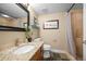 Cozy bathroom with a granite countertop vanity, a shower-tub combo, and neutral color scheme at 7717 S Grape Ct, Centennial, CO 80122