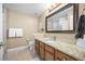 Functional bathroom with a single sink vanity, neutral color scheme, and essential fixtures at 7717 S Grape Ct, Centennial, CO 80122