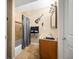 Well-lit bathroom featuring stone floors, granite countertop, and decorative guitar wall art at 7717 S Grape Ct, Centennial, CO 80122