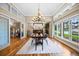 Elegant dining room with a chandelier and large windows at 7717 S Grape Ct, Centennial, CO 80122