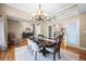 Bright dining room with elegant chandelier and hardwood floors at 7717 S Grape Ct, Centennial, CO 80122
