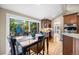Eat in kitchen area with access to outside patio and kitchen bar at 7717 S Grape Ct, Centennial, CO 80122