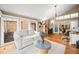 Bright living room with large windows and a view of the outdoor scenery at 7717 S Grape Ct, Centennial, CO 80122