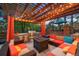 Outdoor living area with a built-in grill, fire pit, and comfortable seating at 7717 S Grape Ct, Centennial, CO 80122