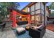 Backyard patio with a pergola, outdoor seating, and a view of the landscaped yard at 7717 S Grape Ct, Centennial, CO 80122