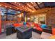 Spacious patio with a pergola, fire pit, and comfortable seating for entertaining at 7717 S Grape Ct, Centennial, CO 80122