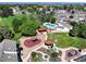 Aerial view showcasing the community pool, playground, and manicured landscaping at 10150 E Virginia Ave # 13-204, Denver, CO 80247