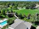 Aerial view of condo with community green space and swimming pool at 10150 E Virginia Ave # 13-204, Denver, CO 80247