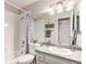 Cozy bathroom featuring granite countertops and shower with curtain at 10150 E Virginia Ave # 13-204, Denver, CO 80247
