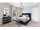 Modern bedroom features stylish decor, ample natural light, and plush carpeting at 10150 E Virginia Ave # 13-204, Denver, CO 80247