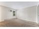 Spacious bedroom with large window and neutral carpet, perfect for relaxation at 10150 E Virginia Ave # 13-204, Denver, CO 80247