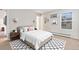 Bright bedroom with neutral walls, cozy carpeting, and modern decorative touches at 10150 E Virginia Ave # 13-204, Denver, CO 80247