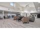 Large clubhouse interior with seating areas, tables and a kitchen in a well lit and spacious area at 10150 E Virginia Ave # 13-204, Denver, CO 80247