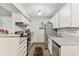 Efficient kitchen featuring stainless steel appliances, ample counter space, and convenient layout at 10150 E Virginia Ave # 13-204, Denver, CO 80247