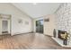 Bright living space with hardwood floors, balcony, and fireplace at 10150 E Virginia Ave # 13-204, Denver, CO 80247