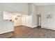 Spacious living area featuring hardwood floors, ample lighting, and storage at 10150 E Virginia Ave # 13-204, Denver, CO 80247