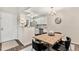 Open concept living and kitchen area with stainless steel appliances and a dining table with seating at 10150 E Virginia Ave # 13-204, Denver, CO 80247